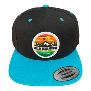 Black fis trucker hat with a turquoise bill with a retro mountain patch on the front